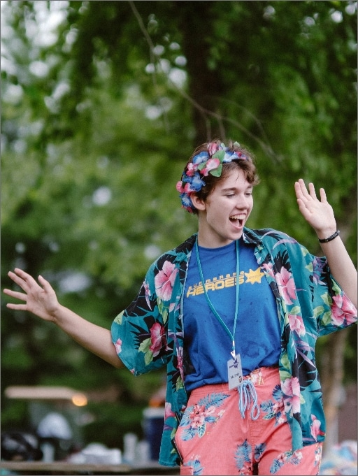Camp leader dancing with colorful clothing