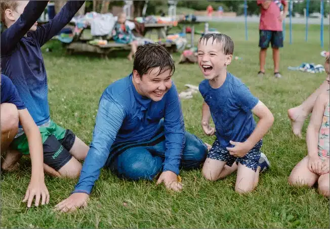 Kids laughing after playing in water